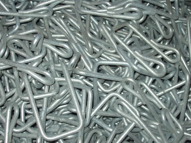 pile of steel bars point staples